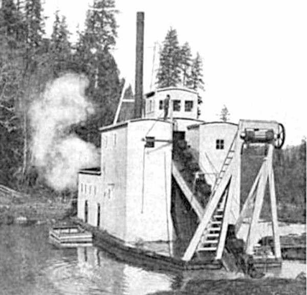 Photo of the Josephine gold dredge operating in pond, southwest Oregon
